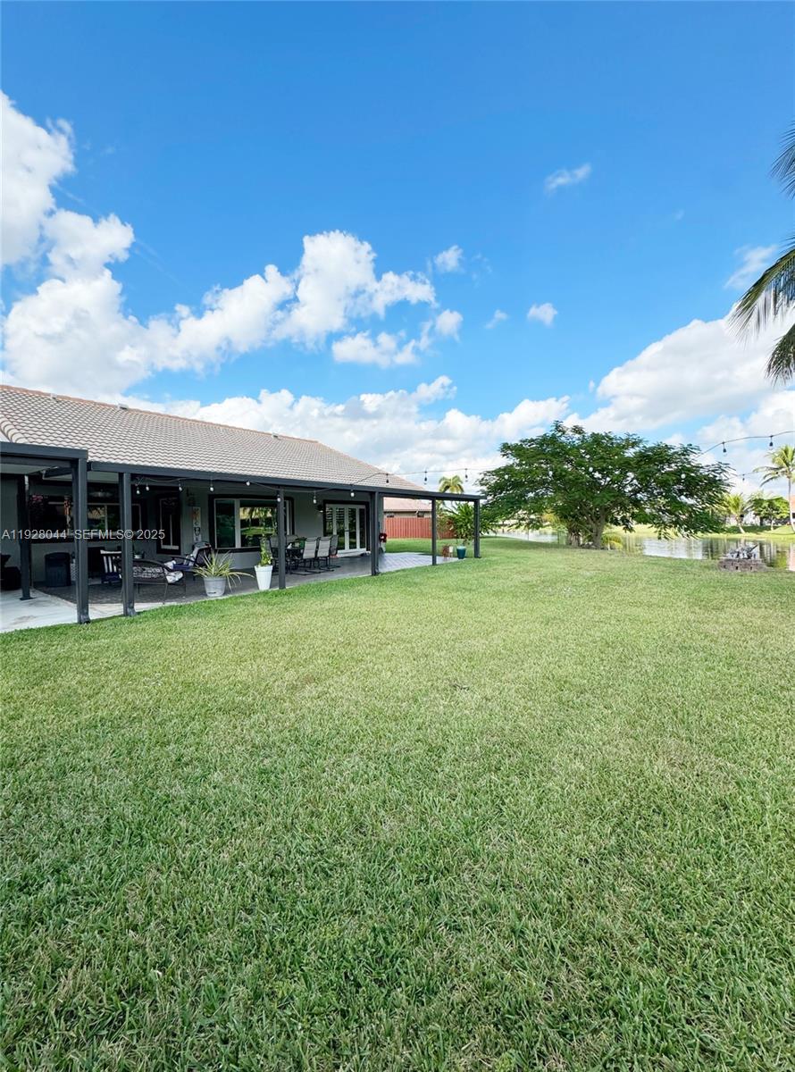 15500 Carriage Court Davie, FL 33331 - Photo 22 of 26 a view of a house with a big yard