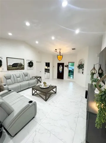 a living room with furniture and a couch