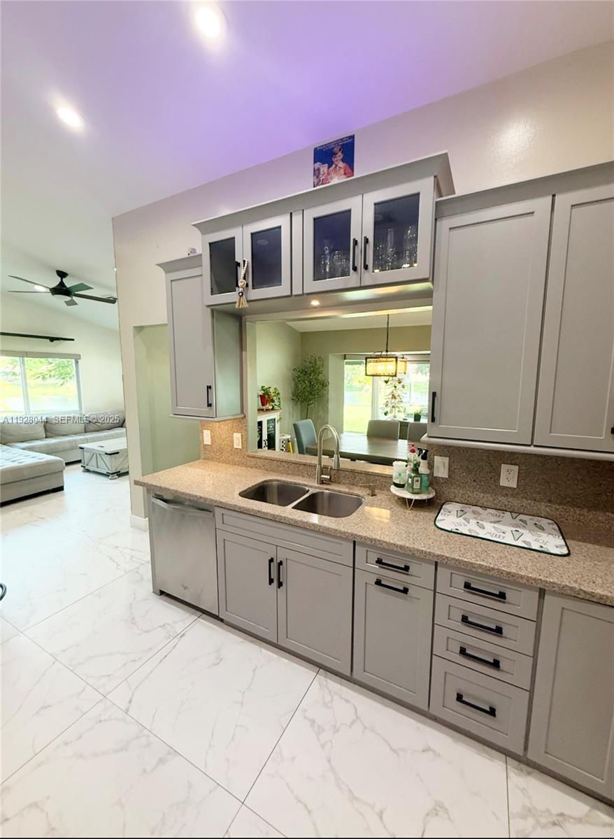 15500 Carriage Court Davie, FL 33331 - Photo 10 of 26 a bathroom with a granite countertop double vanity sink and mirror