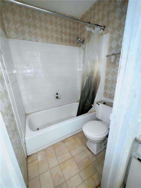 1150 Rankin Street, Unit 4J Stone Mountain, GA 30083 - Photo 11 of 16 a bathroom with a granite countertop sink toilet and shower