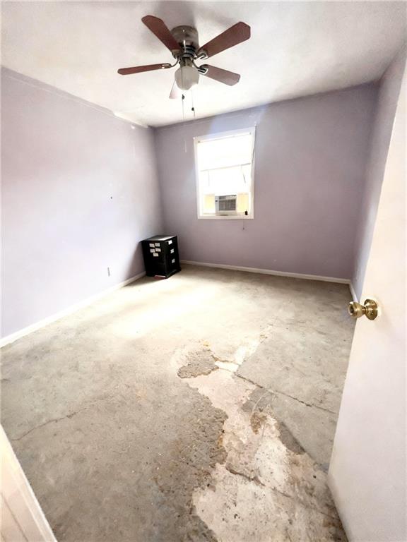 1150 Rankin Street, Unit 4J Stone Mountain, GA 30083 - Photo 12 of 16 an empty room with windows and ceiling fan