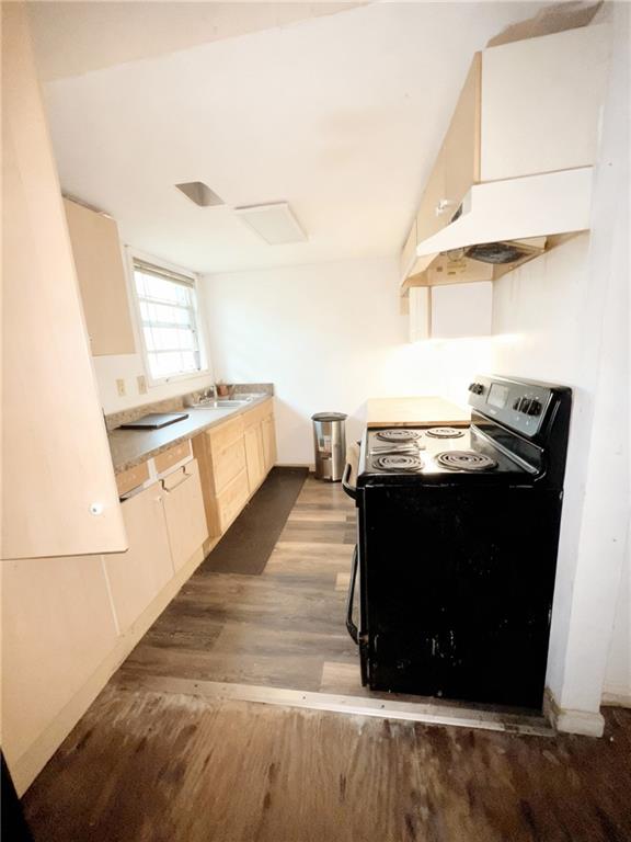 1150 Rankin Street, Unit 4J Stone Mountain, GA 30083 - Photo 5 of 16 a kitchen with a stove and a refrigerator