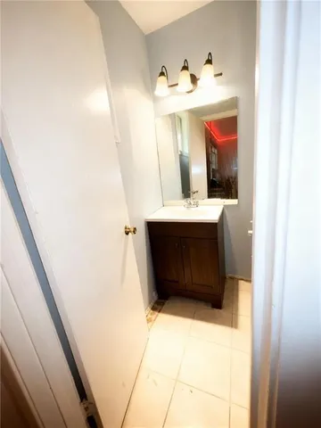 a bathroom with a sink and mirror
