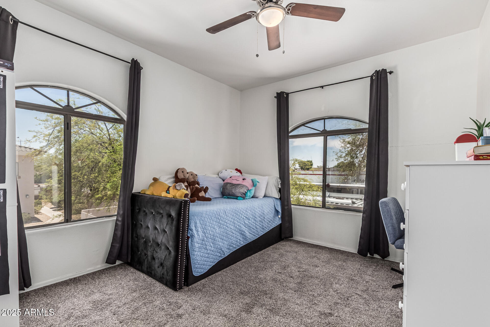 10030 West Indian School Road, Unit 255 Phoenix, AZ 85037 - Photo 17 of 27 a bed room with a bed and a window