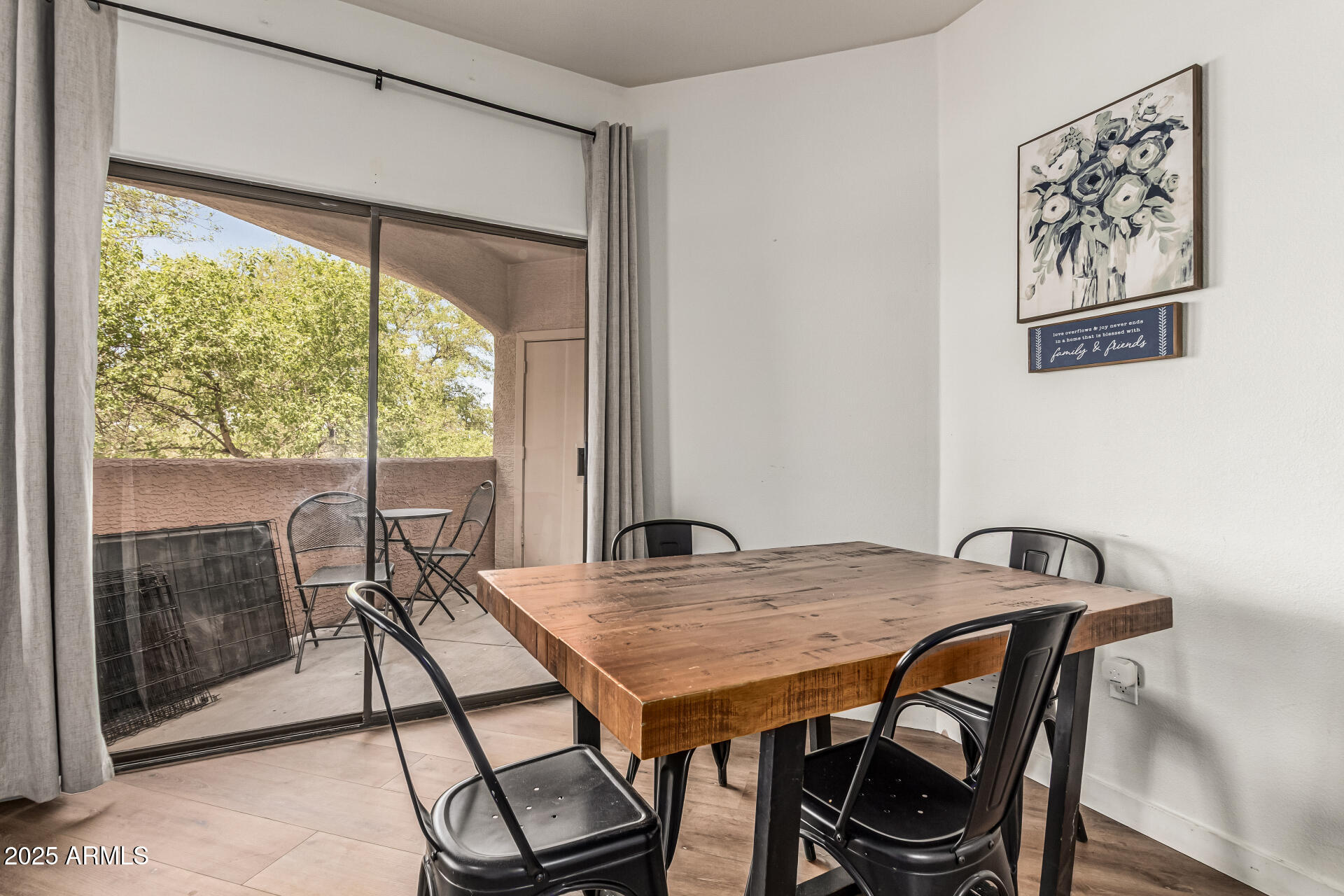 10030 West Indian School Road, Unit 255 Phoenix, AZ 85037 - Photo 7 of 27 a view of a dining room with furniture window and outside view