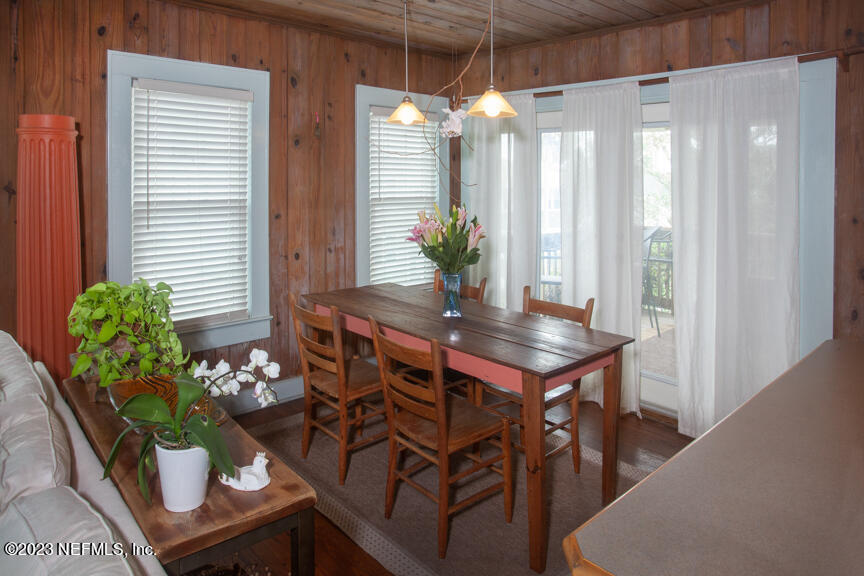 1416 Strand Street Neptune Beach, FL 32266 - Photo 12 of 27 a dining room with furniture and potted plants