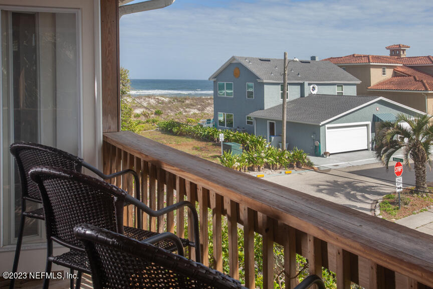 1416 Strand Street Neptune Beach, FL 32266 - Photo 17 of 27 a view of a brick house with a large window and potted plants
