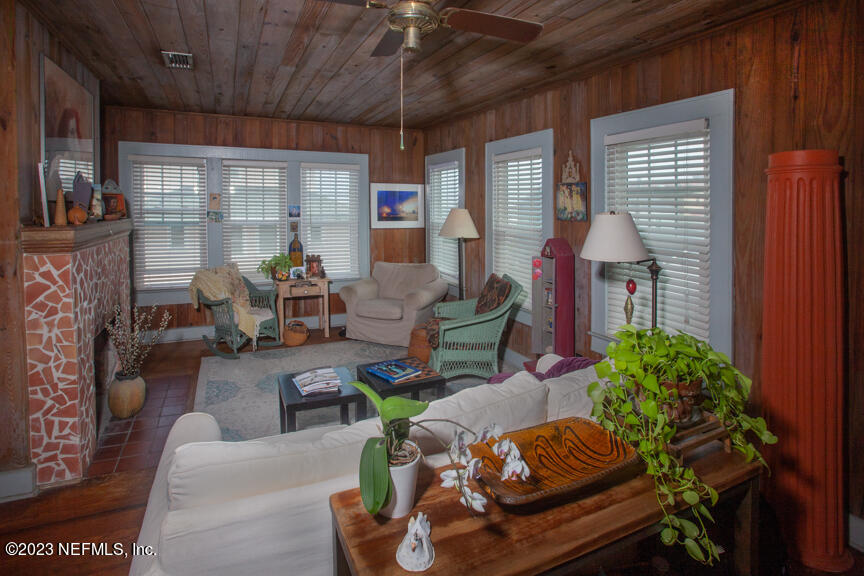 1416 Strand Street Neptune Beach, FL 32266 - Photo 18 of 27 a living room with furniture and a potted plant