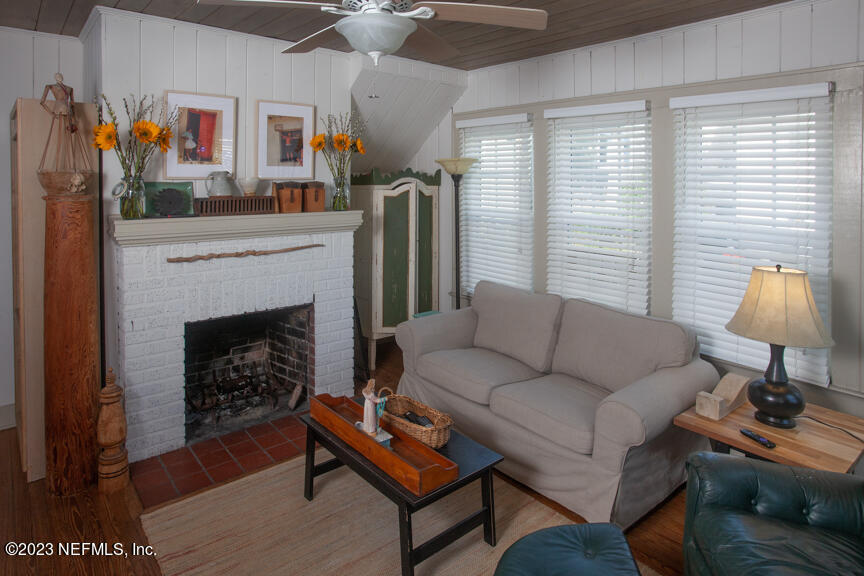 1416 Strand Street Neptune Beach, FL 32266 - Photo 2 of 27 a living room with furniture and a fireplace