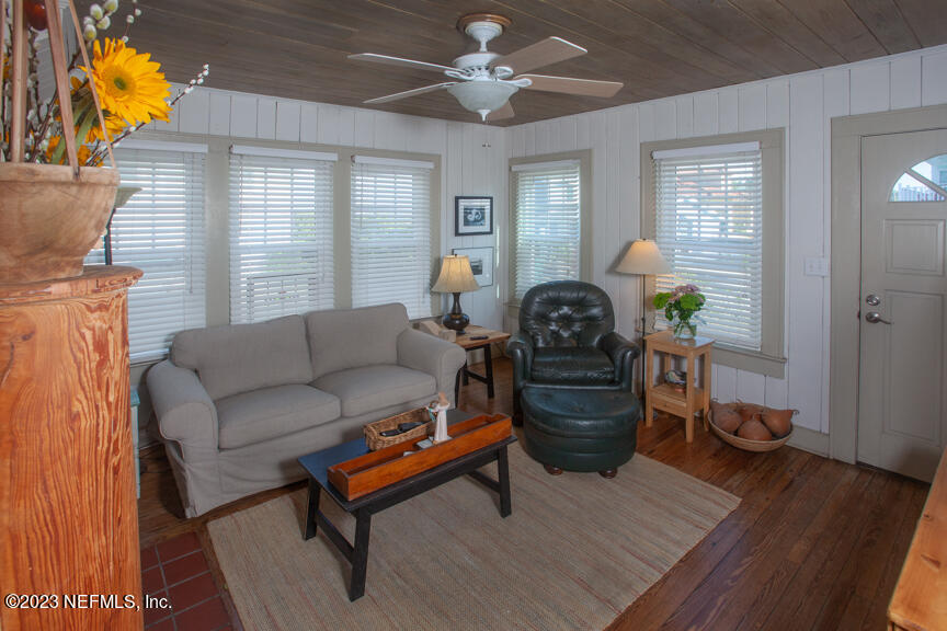 1416 Strand Street Neptune Beach, FL 32266 - Photo 3 of 27 a living room with furniture and a wooden floor