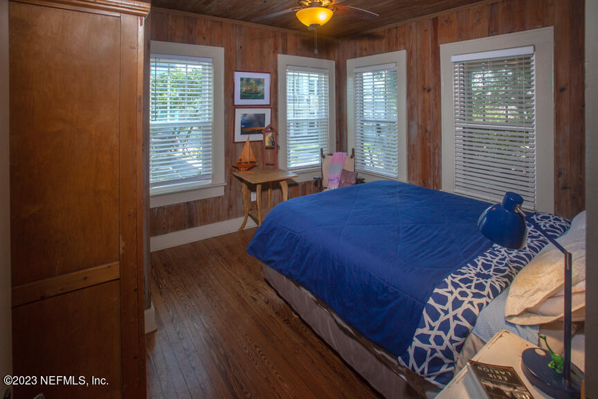 1416 Strand Street Neptune Beach, FL 32266 - Photo 5 of 27 a bed sitting in a bedroom next to a window