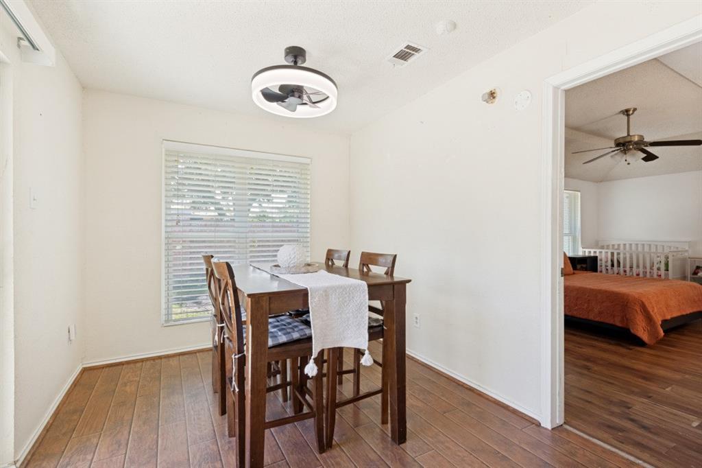 7410 Jessica Way Rowlett, TX 75088 - Photo 12 of 25 a view of a dining room with furniture and wooden floor