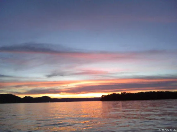 a view of a swimming pool with a lake view