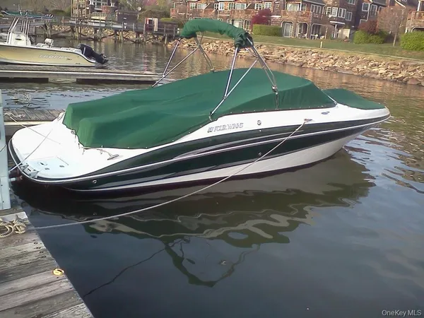 a view of water with boats and trees