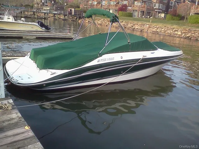a view of water with boats and trees