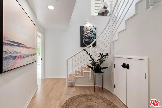 a bed room with a bed and a large window