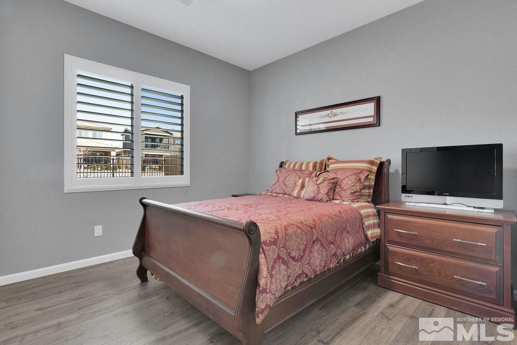2335 Buttermere Drive Reno, NV 89521 - Photo 19 of 37 a bedroom with a bed and a flat screen tv
