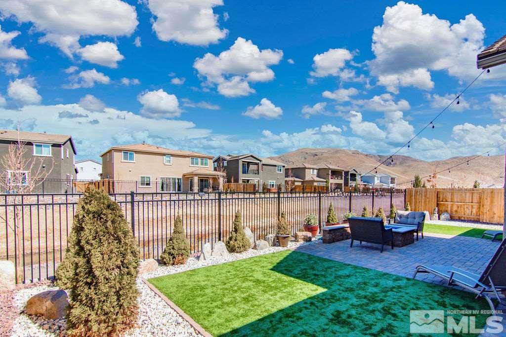2335 Buttermere Drive Reno, NV 89521 - Photo 27 of 37 a front view of a house with a garden and yard