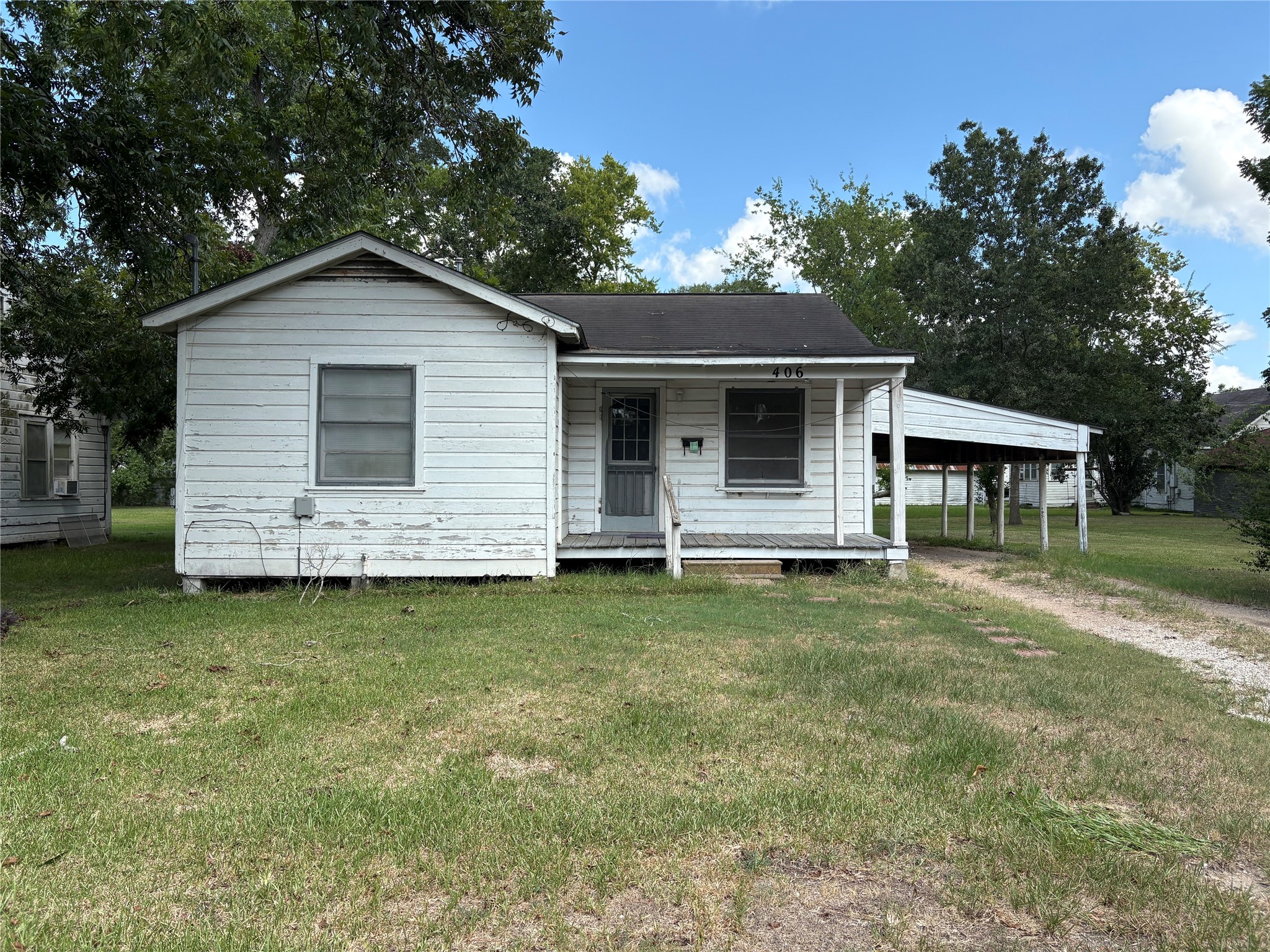 406 Omega Street El Campo, TX 77437 - Photo 1 of 13 a backyard of a house with table and chairs