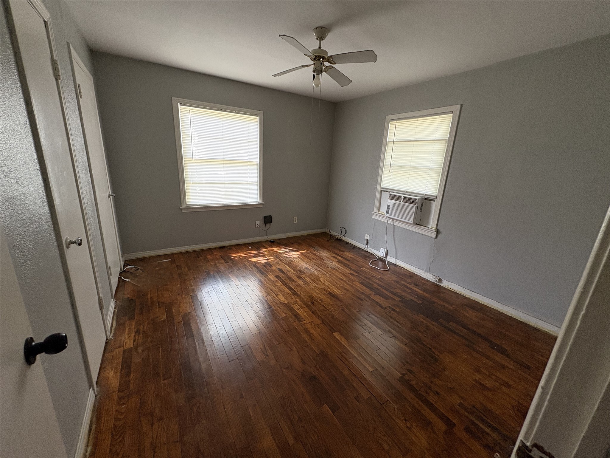 406 Omega Street El Campo, TX 77437 - Photo 11 of 13 a view of empty room with wooden floor and fan