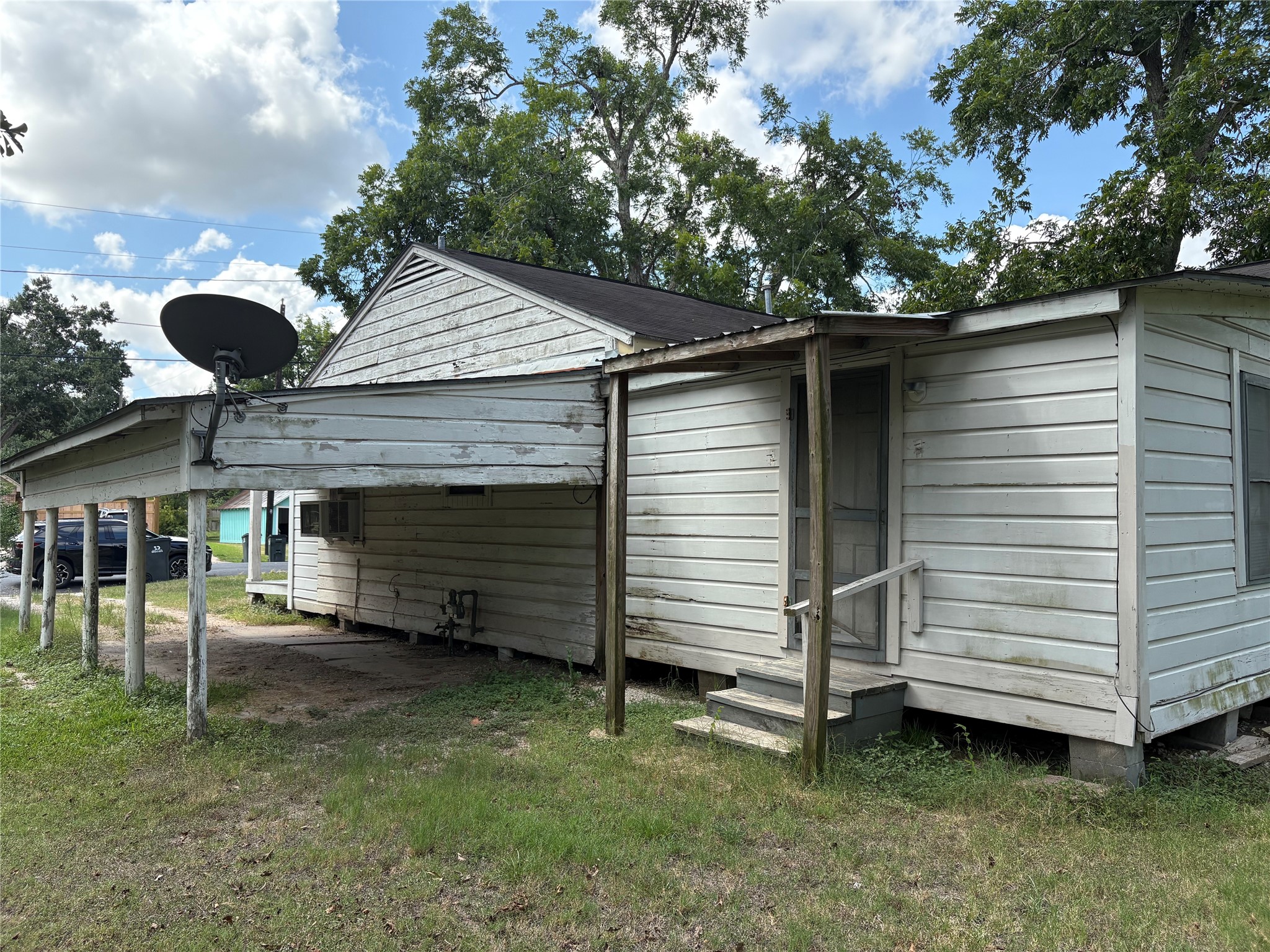 406 Omega Street El Campo, TX 77437 - Photo 6 of 13 a view of a house with a backyard