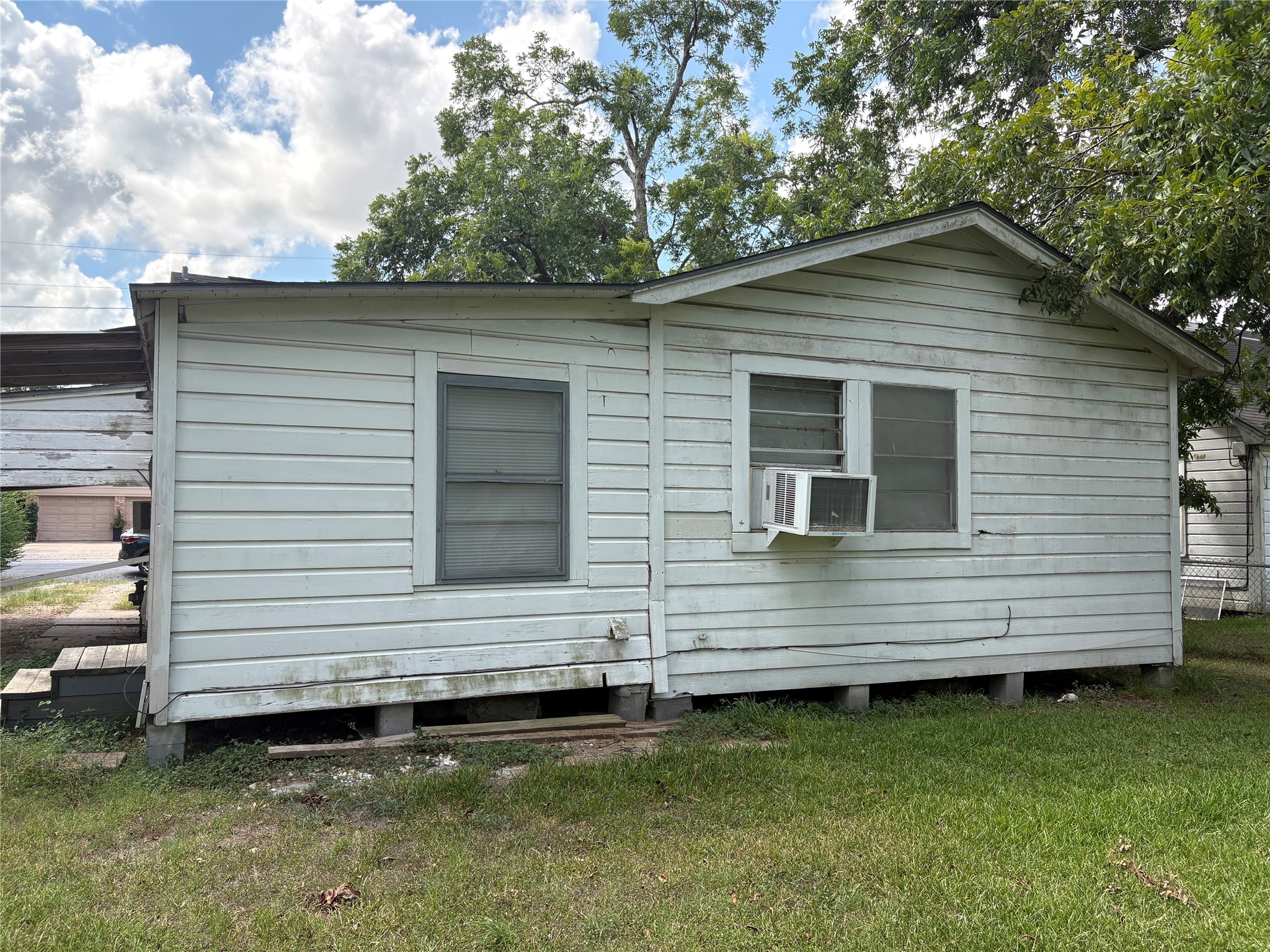 406 Omega Street El Campo, TX 77437 - Photo 7 of 13 a view of a house with a yard