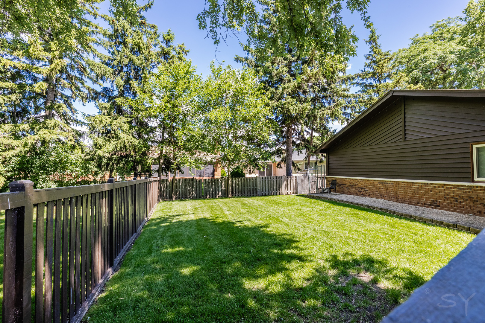 1312 North River Road Mount Prospect, IL 60056 - Photo 21 of 31 a backyard of a house with lots of green space