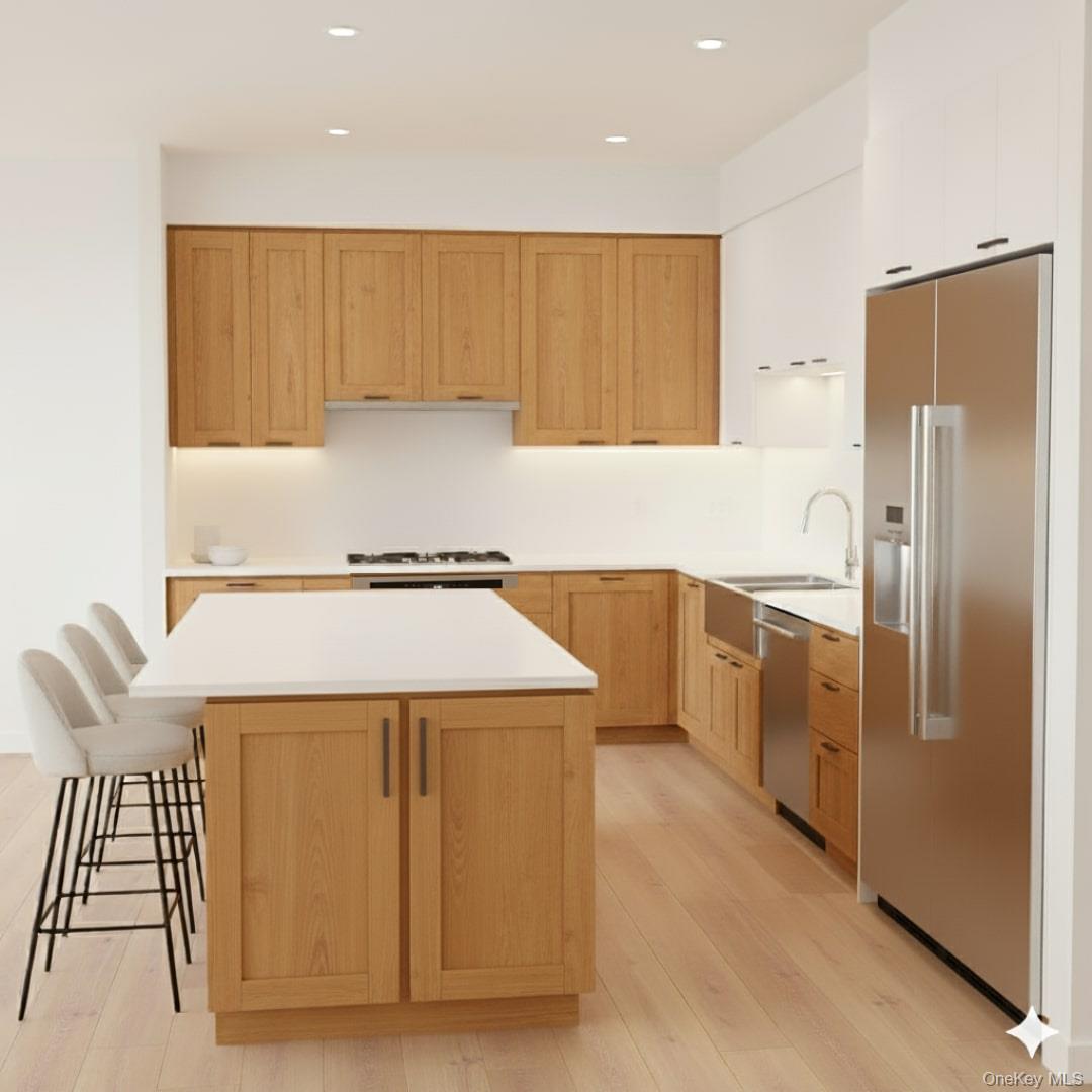 527 Union Avenue Peekskill, NY 10566 - Photo 2 of 10 a kitchen with a refrigerator sink and cabinets