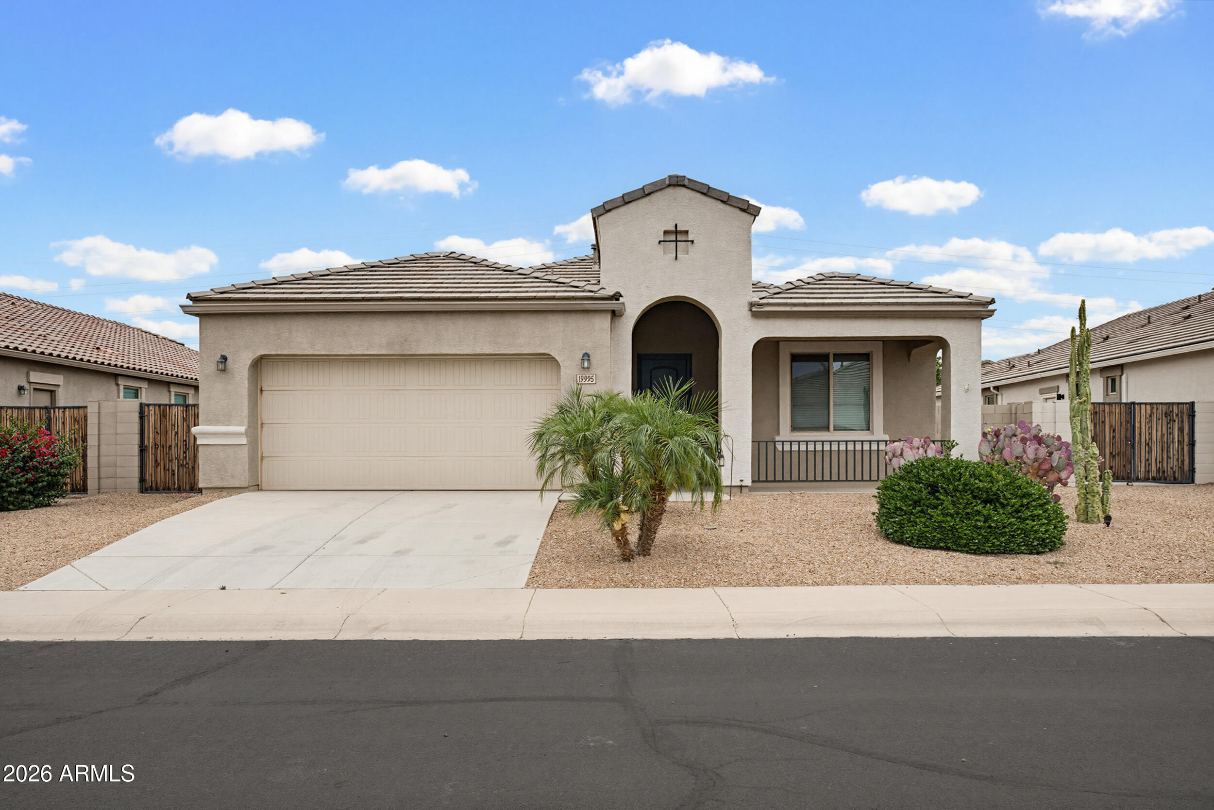 19995 North Ben Court Maricopa, AZ 85138 - Photo 2 of 51 a front view of a house with garden
