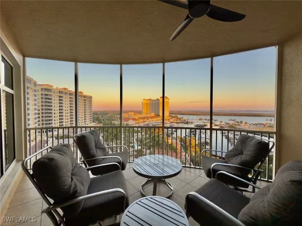 a balcony with furniture and city view