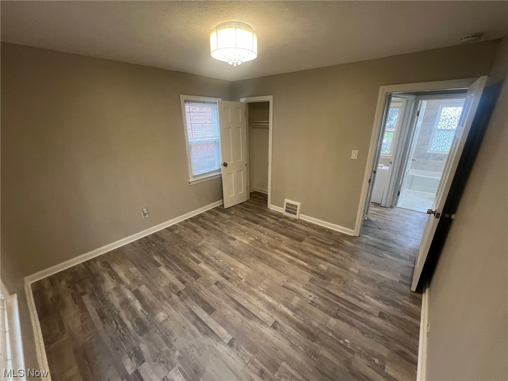 1508 Winchester Road Lyndhurst, OH 44124 - Photo 16 of 23 Unfurnished bedroom with a closet and dark hardwood / wood-style flooring