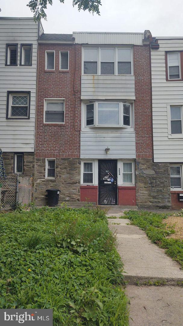 a view of a house with a garden