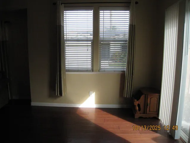 a view of an empty room and a window