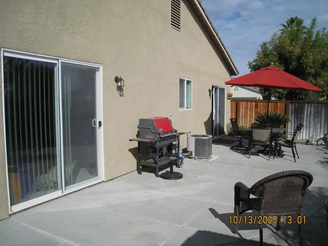 a dining room with furniture and rug floor