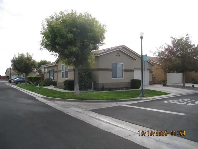 a house that has a tree in front of it