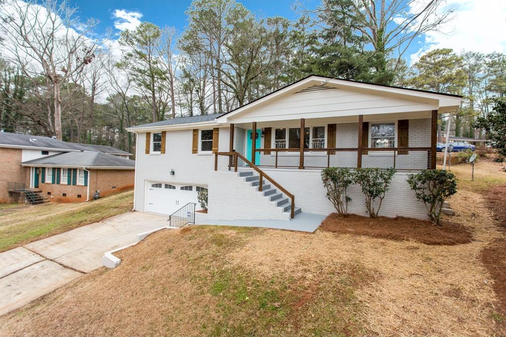 2671 Terratim Lane Decatur, GA 30034 - Photo 1 of 1 a front view of a house with a yard and potted plants