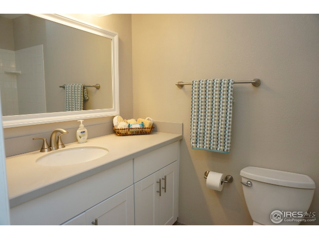 2707 Valmont Road, Unit 210D Boulder, CO 80304 - Photo 11 of 13 a bathroom with a sink a toilet and mirror