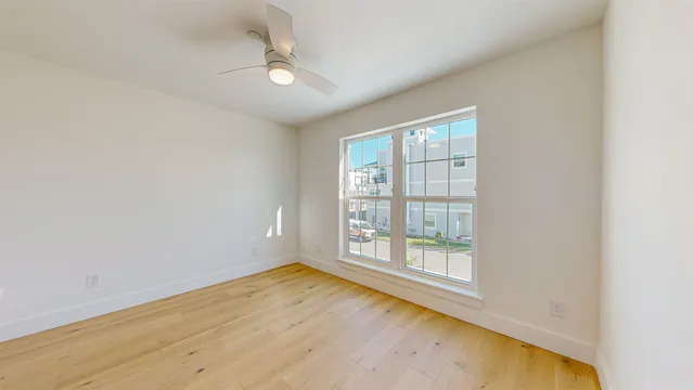 a bedroom with a bed and a lamp