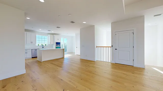 a white stove top oven sitting inside of a kitchen