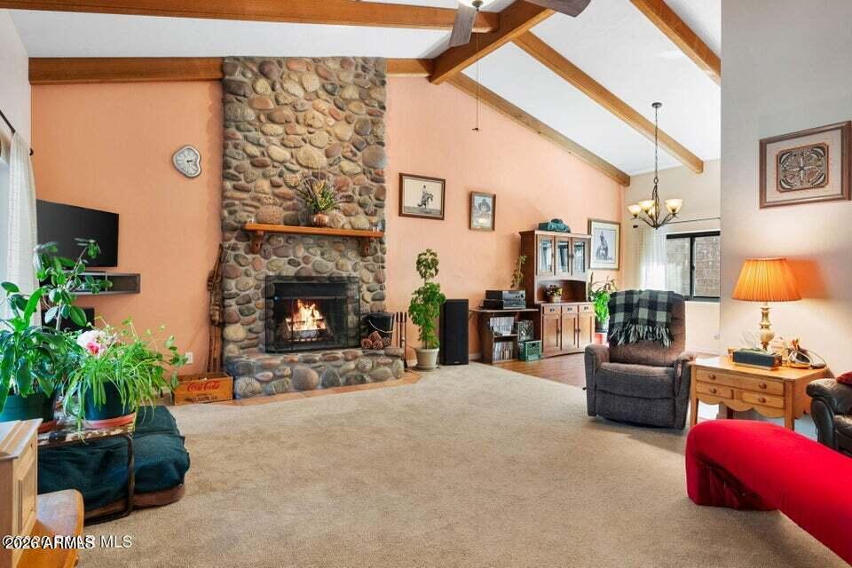 4969 West Iron Springs Road Prescott, AZ 86305 - Photo 10 of 44 a living room with furniture and a fireplace