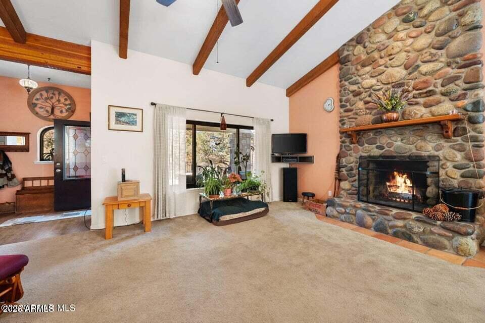 4969 West Iron Springs Road Prescott, AZ 86305 - Photo 12 of 44 a living room with furniture and a fireplace