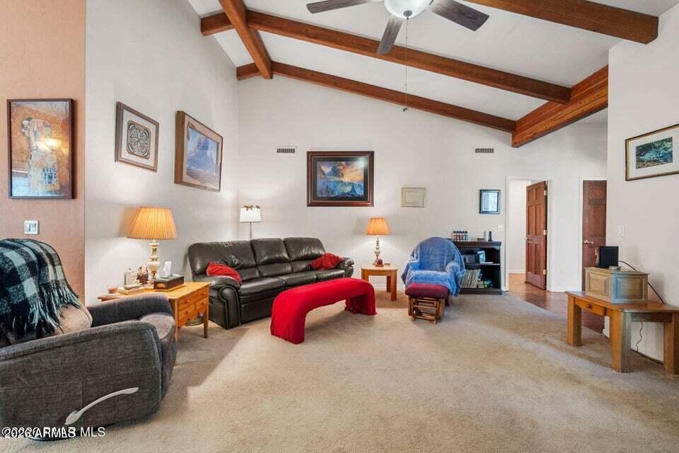 4969 West Iron Springs Road Prescott, AZ 86305 - Photo 13 of 44 a bed room with furniture and a lamp