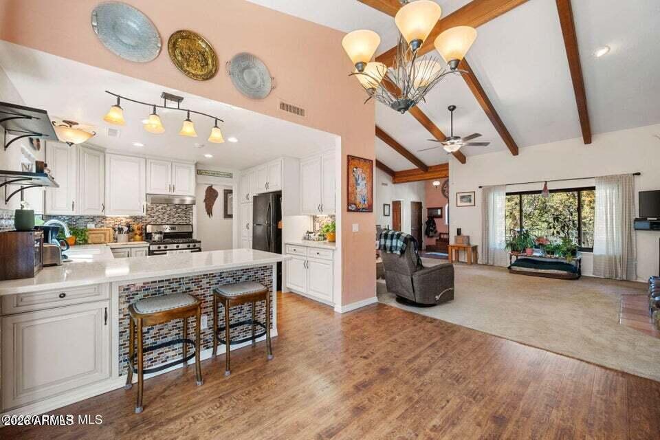 4969 West Iron Springs Road Prescott, AZ 86305 - Photo 15 of 44 a view of a kitchen and chandelier