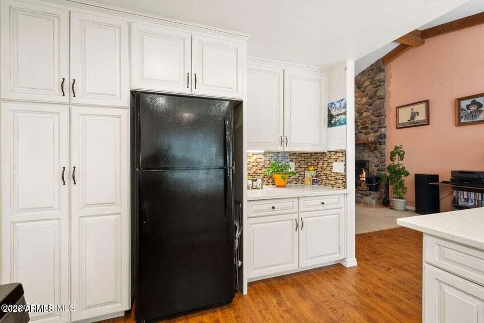 4969 West Iron Springs Road Prescott, AZ 86305 - Photo 18 of 44 a kitchen with stainless steel appliances a refrigerator and cabinets