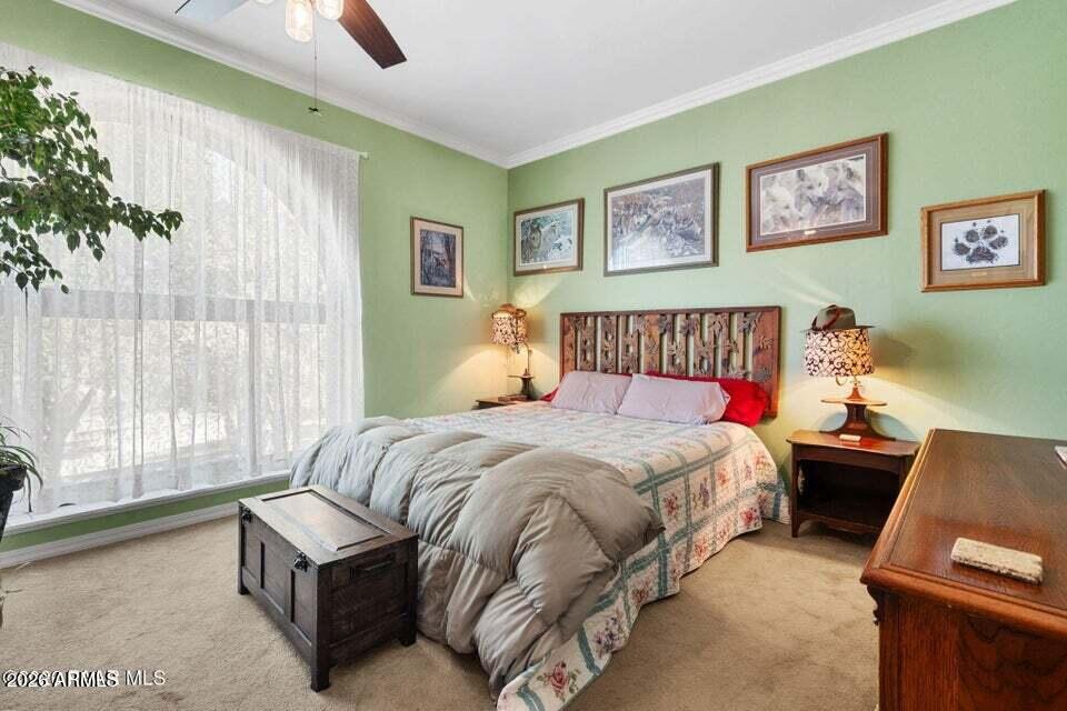 4969 West Iron Springs Road Prescott, AZ 86305 - Photo 21 of 44 a spacious bedroom with a bed and a couch