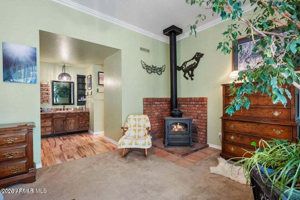 4969 West Iron Springs Road Prescott, AZ 86305 - Photo 22 of 44 a living room with furniture and a potted plant