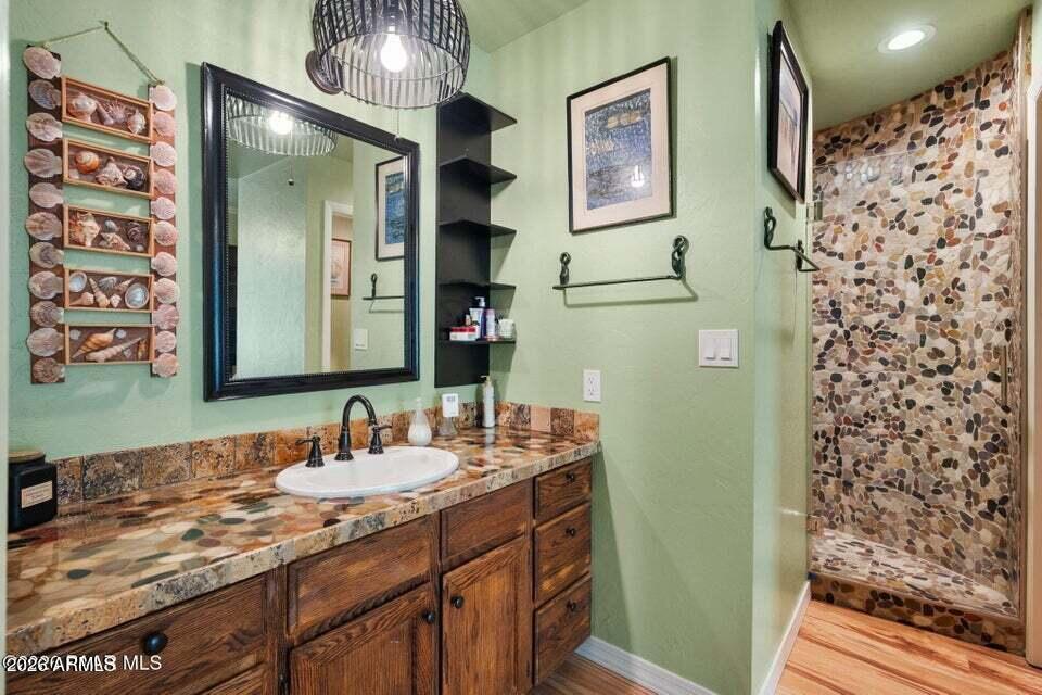 4969 West Iron Springs Road Prescott, AZ 86305 - Photo 24 of 44 a bathroom with a sink and a mirror