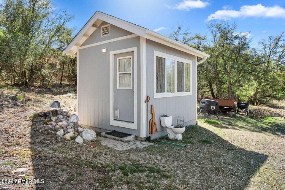 4969 West Iron Springs Road Prescott, AZ 86305 - Photo 33 of 44 a view of a house with a yard