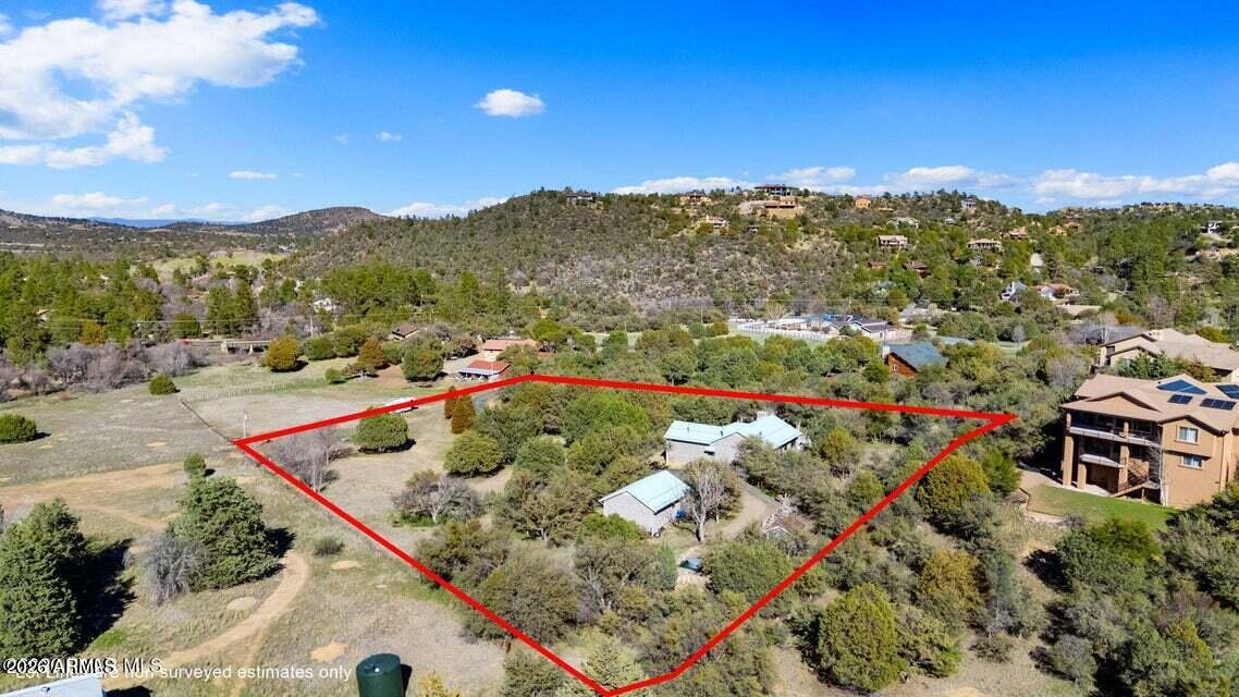 4969 West Iron Springs Road Prescott, AZ 86305 - Photo 41 of 44 an aerial view of residential houses with outdoor space and seating