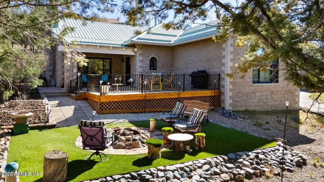 4969 West Iron Springs Road Prescott, AZ 86305 - Photo 4 of 44 a view of a swimming pool with a patio